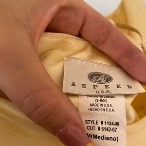 Yellow dress with diamond on top.